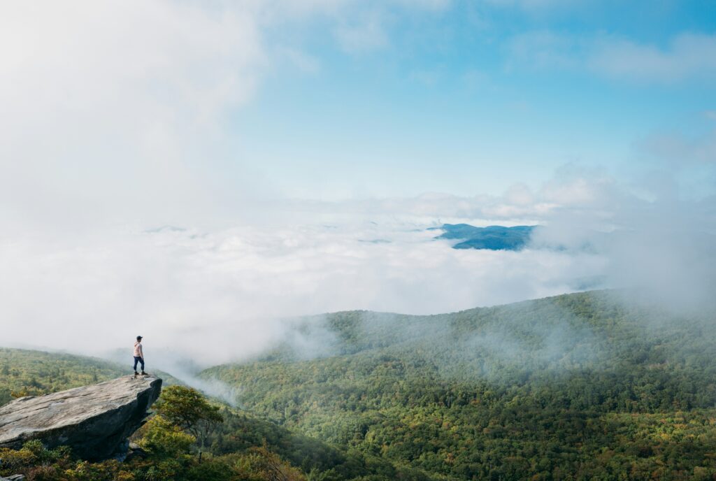 Person looking over a ridge